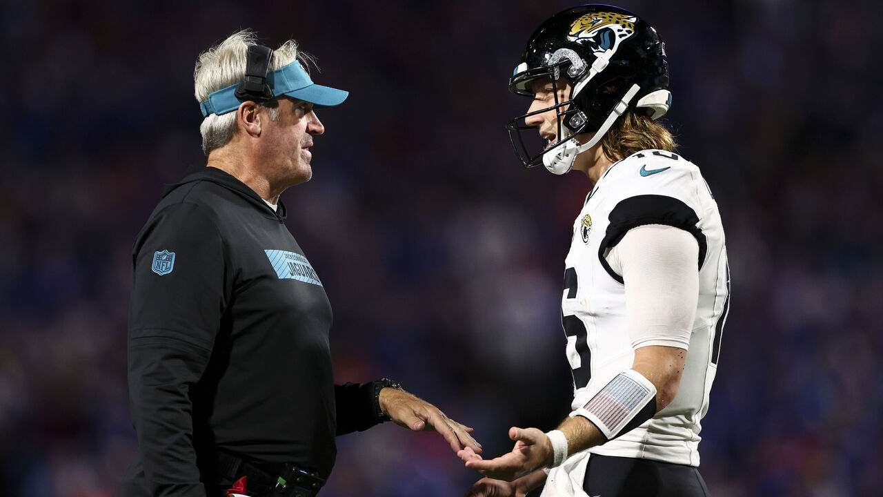 ORCHARD PARK, NY - SEPTEMBER 23: Head coach Doug Pederson of the Jacksonville Jaguars talks with Trevor Lawrence #16 during the fourth quarter of an NFL football game against the Buffalo Bills at Highmark Stadium on September 23, 2024 in Orchard Park, New York.