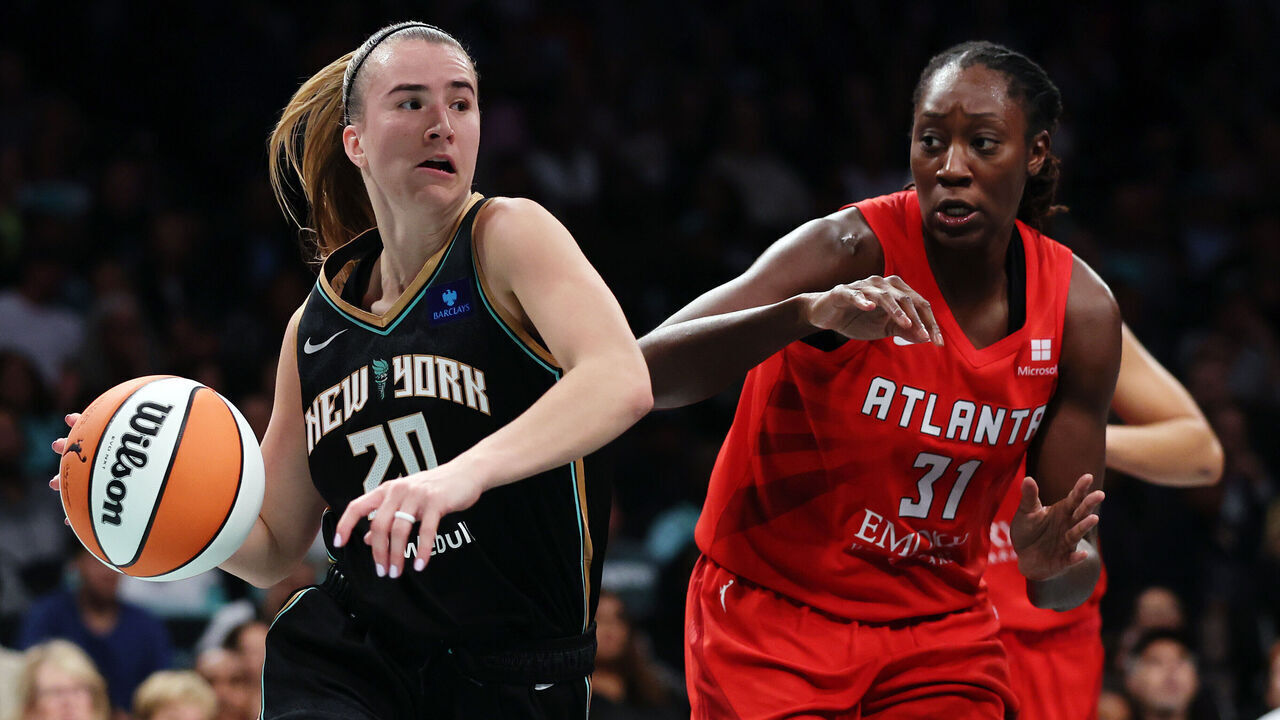 NEW YORK, NEW YORK - SEPTEMBER 24: Sabrina Ionescu #20 of the New York Liberty dribbles against Tina Charles #31 of the Atlanta Dream during the first half in Game Two of Round One of the WNBA Playoffs at Barclays Center on September 24, 2024 in the Brooklyn borough of New York City.