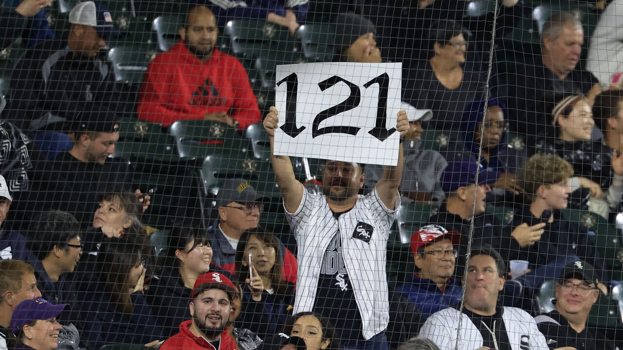 CHICAGO, ILLINOIS - SEPTEMBER 24: Chicago White Sox fans hold up a 121 sign during the sixth inning in the game between the Los Angeles Angels and the Chicago White Sox at Guaranteed Rate Field on September 24, 2024 in Chicago, Illinois.