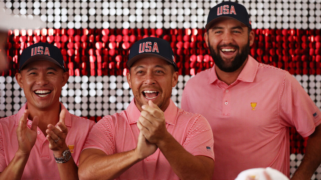 MONTREAL, QUEBEC - SEPTEMBER 25: Collin Morikawa, Xander Schauffele and Scottie Scheffler of the U.S. Team laugh prior to the 2024 Presidents Cup at The Royal Montreal Golf Club on September 25, 2024 in Montreal, Quebec, Canada.