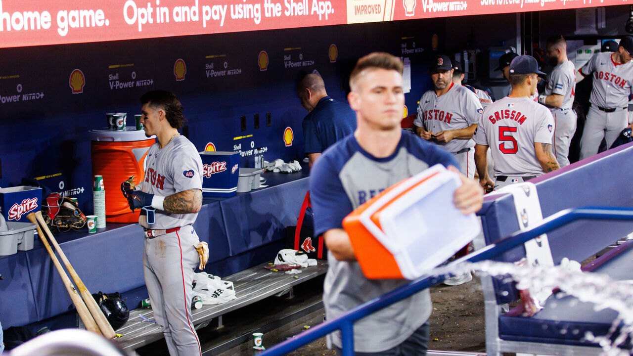TORONTO, CANADA - SEPTEMBER 25: Jarren Duran #16 of the Boston Red Sox and players clean out the dugout after their MLB game loss to the Toronto Blue Jays at Rogers Centre on September 25, 2024 in Toronto, Ontario, Canada.