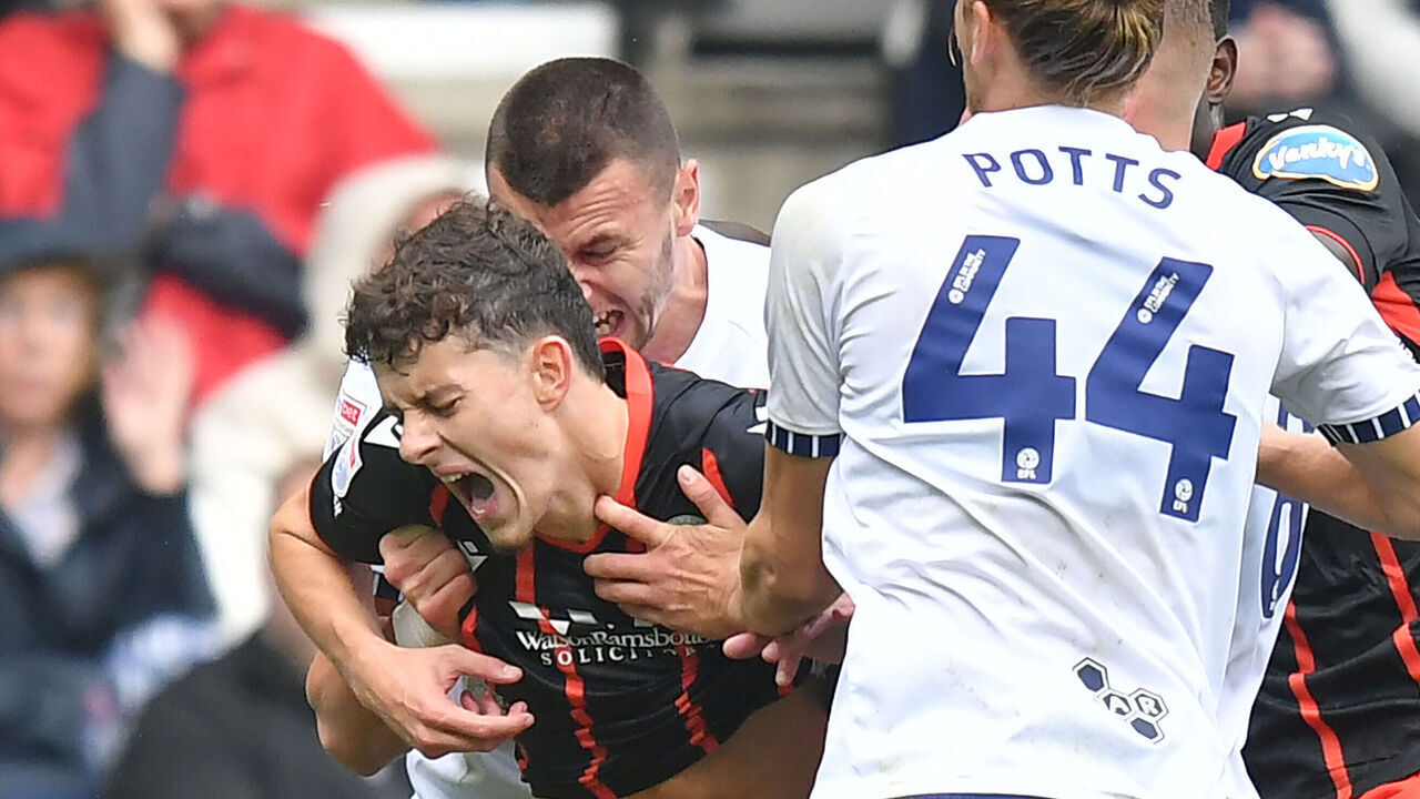 PRESTON, ENGLAND - SEPTEMBER 22:Blackburn Rovers' Owen Beck seems to be bitten on the neck by Preston North End's Milutin Osmajic during the Sky Bet Championship match between Preston North End FC and Blackburn Rovers FC at Deepdale on September 22, 2024 in Preston, England.