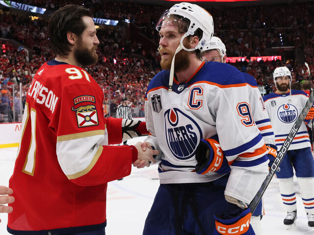 SUNRISE, FLORIDA - JUNE 24: Oliver Ekman-Larsson #91 of the Florida Panthers shakes hands with Connor McDavid #97 of the Edmonton Oilers after Florida's 2-1 victory in Game Seven of the 2024 Stanley Cup Final at Amerant Bank Arena on June 24, 2024 in Sunrise, Florida.