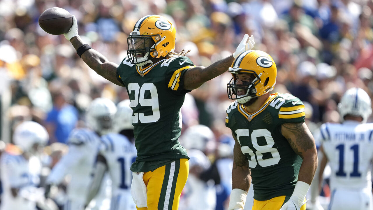 GREEN BAY, WISCONSIN - SEPTEMBER 15: Xavier McKinney #29 of the Green Bay Packers celebrates with teammate Isaiah McDuffie #58 after intercepting a pass against the Indianapolis Colts during the first quarter at Lambeau Field on September 15, 2024 in Green Bay, Wisconsin.
