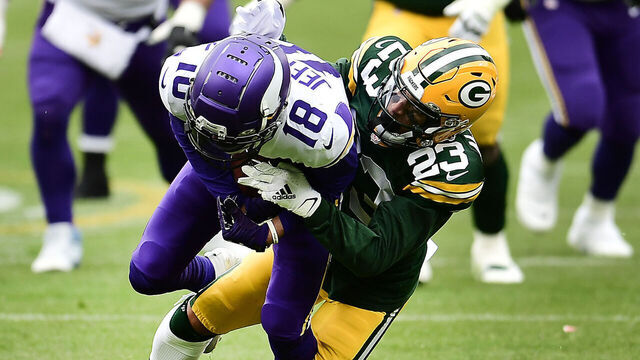 GREEN BAY, WISCONSIN - NOVEMBER 01: Justin Jefferson #18 of the Minnesota Vikings runs the ball as Jaire Alexander #23 of the Green Bay Packers defends during the second quarter of the game at Lambeau Field on November 01, 2020 in Green Bay, Wisconsin.