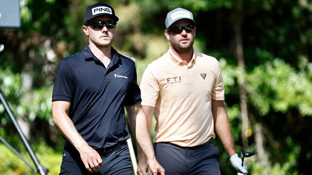 HILTON HEAD ISLAND, SOUTH CAROLINA - APRIL 15: Mackenzie Hughes of Canada (L) and Corey Conners of Canada walk off the 12th tee during the second round of the RBC Heritage at Harbor Town Golf Links on April 15, 2022 in Hilton Head Island, South Carolina.