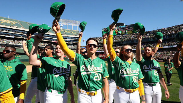 OAKLAND, CALIFORNIA - SEPTEMBER 26: Zack Gelof #20 of the Oakland Athletics and teammates wave to the crowd after they beat the Texas Rangers at the Oakland Coliseum on September 26, 2024 in Oakland, California. Today will be the final Athletics game played at the Coliseum.