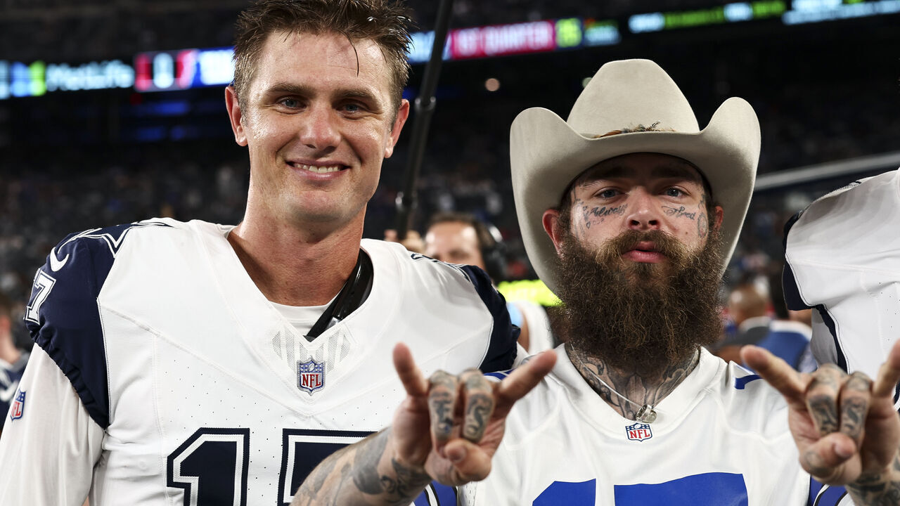 EAST RUTHERFORD, NJ - SEPTEMBER 26: Brandon Aubrey #17 of the Dallas Cowboys poses for a photo with Post Malone prior to an NFL football game against the New York Giants at MetLife Stadium on September 26, 2024 in East Rutherford, New Jersey.
