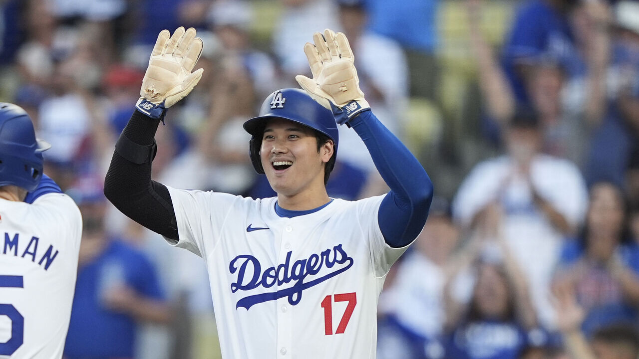 LOS ANGELES, CALIFORNIA - JULY 03: Freddie Freeman #5 of the Los Angeles Dodgers celebrates with his teammates Will Smith #16 and Shohei Ohtani #17 after hitting a three run home run during the first inning of a game between the Los Angeles Dodgers and the Arizona Diamondbacks at Dodger Stadium on July 03, 2024 in Los Angeles, California.