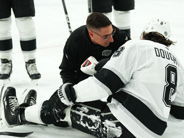 LAS VEGAS, NEVADA - SEPTEMBER 25: Drew Doughty #8 of the Los Angeles Kings reacts after suffering an injury during the first period against the Vegas Golden Knights at T-Mobile Arena on September 25, 2024 in Las Vegas, Nevada.