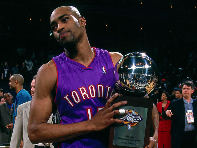 OAKLAND - FEBRUARY 12: Vince Carter #15 of the Toronto Raptors celebrates with the winning with he trophy during the 2000 NBA All Star Slam Dunk Contest at The Arena In Oakland on February 12, 2000 in Oakland, California. Mandatory copyright notice: Copyright NBAE 2000