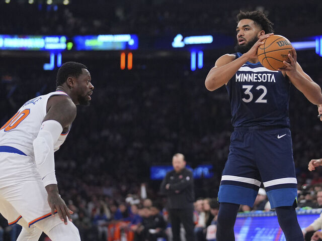 NEW YORK, NEW YORK - JANUARY 1: Karl-Anthony Towns #32 of the Minnesota Timberwolves controls the ball against Julius Randle #30 of the New York Knicks at Madison Square Garden on January 1, 2024 in New York City. The Knicks defeated the Timberwolves 112-106.