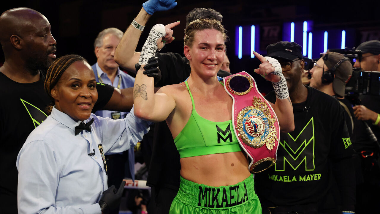 NEW YORK, NEW YORK - SEPTEMBER 27: Mikaela Mayer poses with her belt after defeating Sandy Ryan of England (not pictured) by majority decision during their WBO Welterweight title bout at The Theater at Madison Square Garden on September 27, 2024 in New York City.