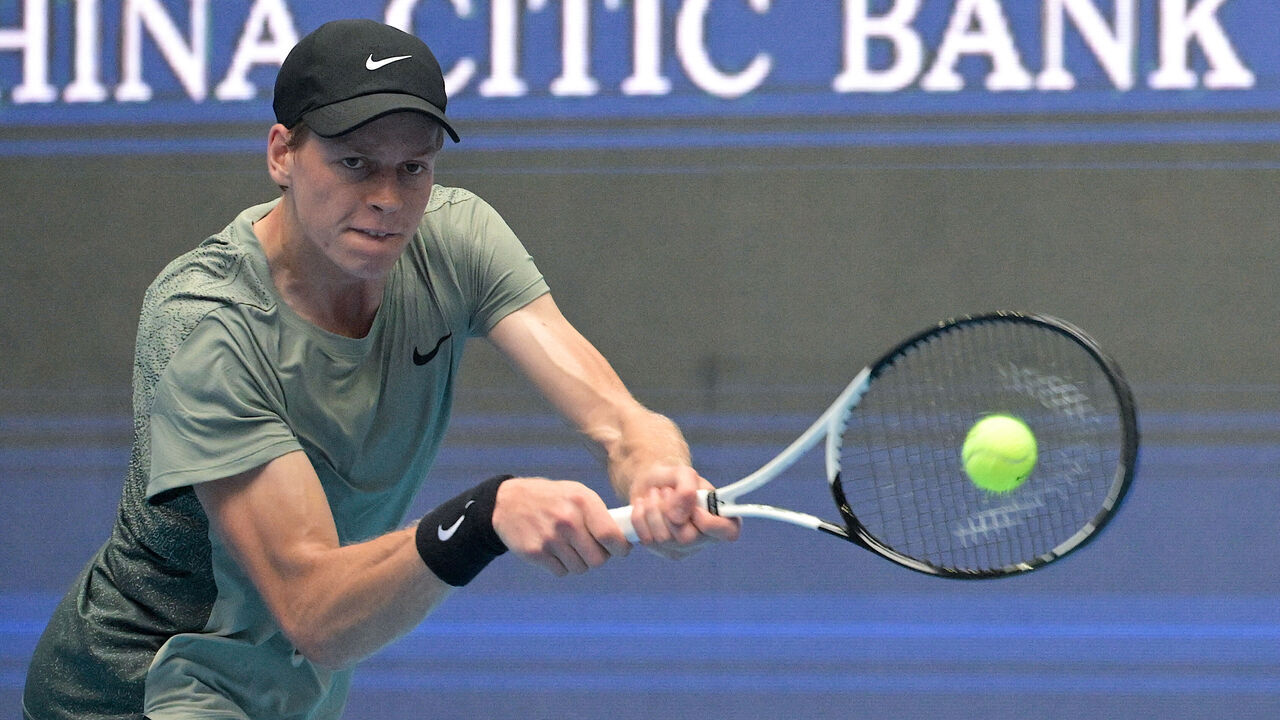 Italy's Jannik Sinner hits a return to Russia's Roman Safiullin during their men's singles match at the China Open tennis tournament in Beijing on September 28, 2024.
