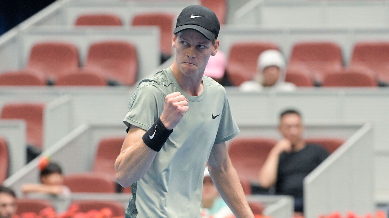Italy's Jannik Sinner reacts while competing against Russia's Roman Safiullin during their men's singles match at the China Open tennis tournament in Beijing on September 28, 2024.