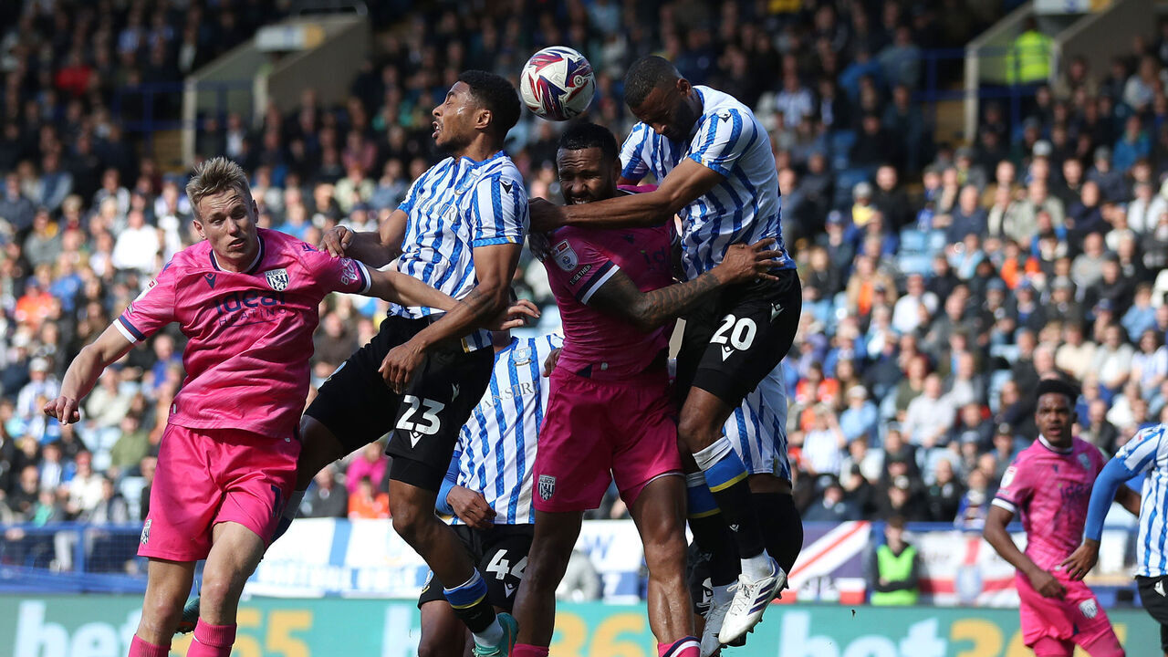 SHEFFIELD, ENGLAND - SEPTEMBER 28: Kyle Bartley of West Bromwich Albion and Michael Ihiekwe of Sheffield Wednesday battle for a header as Torbjorn Heggem of West Bromwich Albion and Akin Famewo of Sheffield Wednesday do the same during the Sky Bet Championship match between Sheffield Wednesday FC and West Bromwich Albion FC at Hillsborough on September 28, 2024 in Sheffield, England.