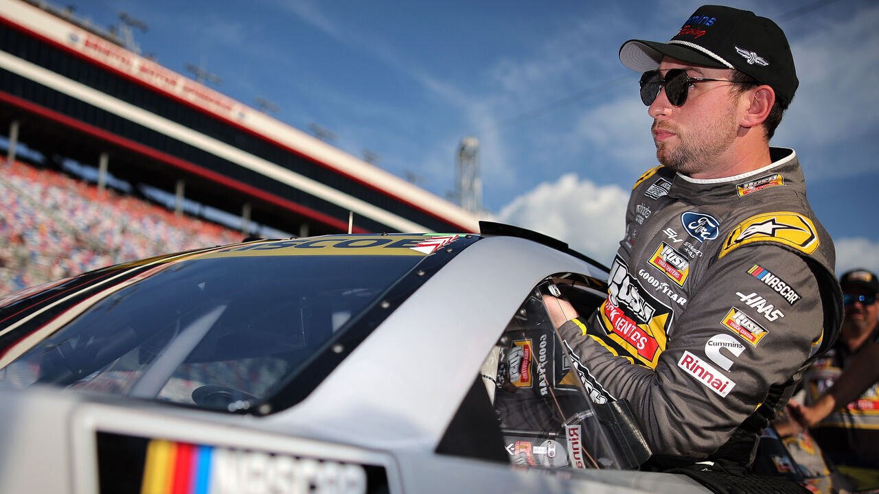 BRISTOL, TENNESSEE - SEPTEMBER 20: Chase Briscoe, driver of the #14 Rush Truck Centers / Cummins Ford, enters his car during qualifying for the NASCAR Cup Series Bass Pro Shops Night Race at Bristol Motor Speedway on September 20, 2024 in Bristol, Tennessee.