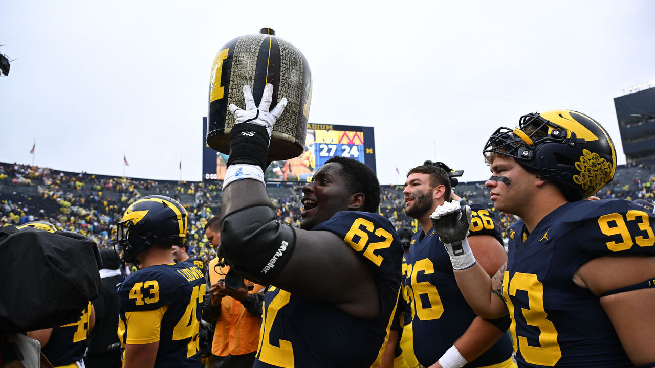 ANN ARBOR, MI - SEPTEMBER 28: Michigan Wolverines offensive lineman Raheem Anderson (62) holds the Little Brown Jug following a 27-24 Michigan Wolverines victory over the Minnesota Golden Gophers game on Saturday September 28, 2024 at Michigan Stadium in Ann Arbor, MI.