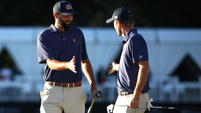 MONTREAL, QUEBEC - SEPTEMBER 28: Scottie Scheffler (L) and Russell Henley of the U.S. Team celebrate on the tenth green during Saturday Afternoon Foursomes on day three of the 2024 Presidents Cup at The Royal Montreal Golf Club on September 28, 2024 in Montreal, Quebec, Canada.