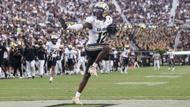 ORLANDO, FL - SEPTEMBER 28: Cornerback Travis Hunter #12 of the Colorado Buffaloes hits the Heisman Pose after making an interception during the game against the UCF Knights at FBC Mortgage Stadium on September 28, 2024 in Orlando, Florida. The Buffaloes defeated the Knights 48 to 21.