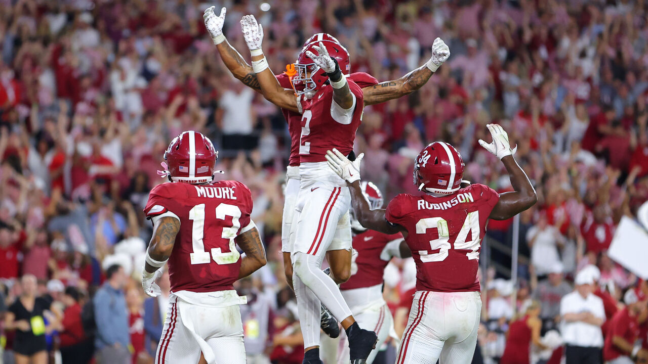 TUSCALOOSA, ALABAMA - SEPTEMBER 28: Zabien Brown #2 of the Alabama Crimson Tide celebrates after his interception against the Georgia Bulldogs with Domani Jackson #1 and teammates during the final minute of the fourth quarter at Bryant-Denny Stadium on September 28, 2024 in Tuscaloosa, Alabama.