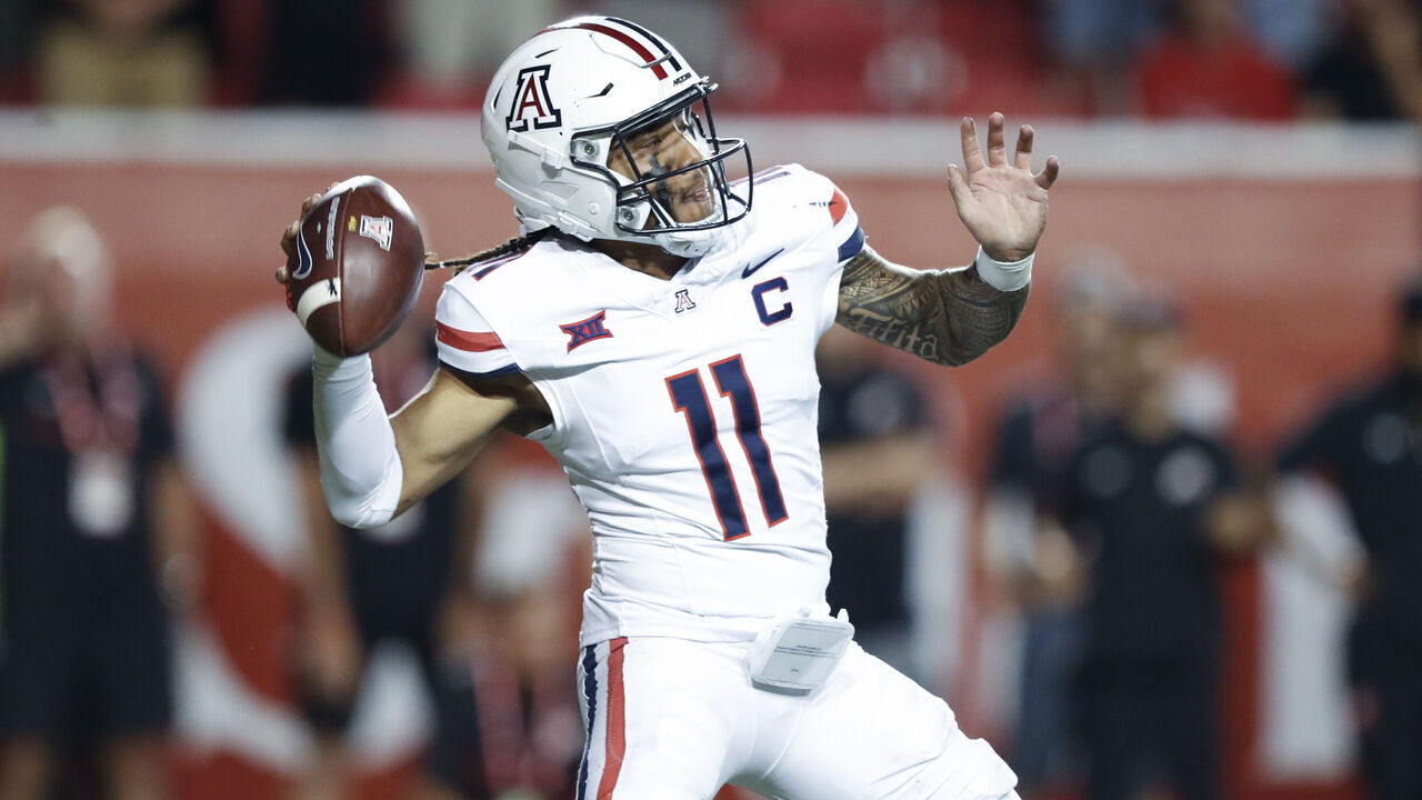 SALT LAKE CITY, UT - SEPTEMBER 28: Noah Fifita #11 of the Arizona Wildcats throws a pass against the Utah Utes during the second half of their game at Rice Eccles Stadium on September 28, 2024 in Salt Lake City, Utah.