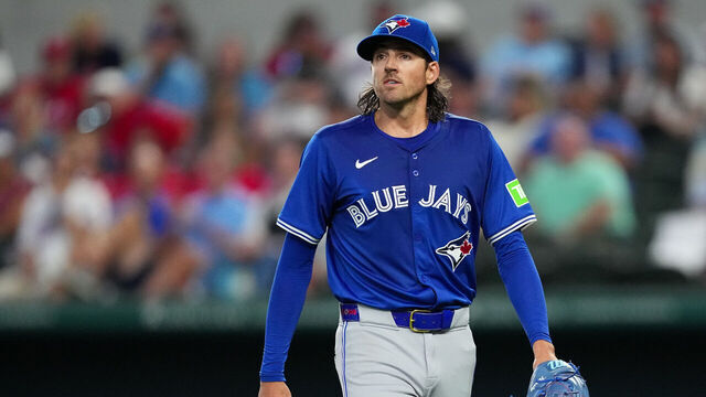 ARLINGTON, TEXAS - SEPTEMBER 19: Kevin Gausman #34 of the Toronto Blue Jays walks off the field after the fourth inning of the game against the Texas Rangers at Globe Life Field on September 19, 2024 in Arlington, Texas.
