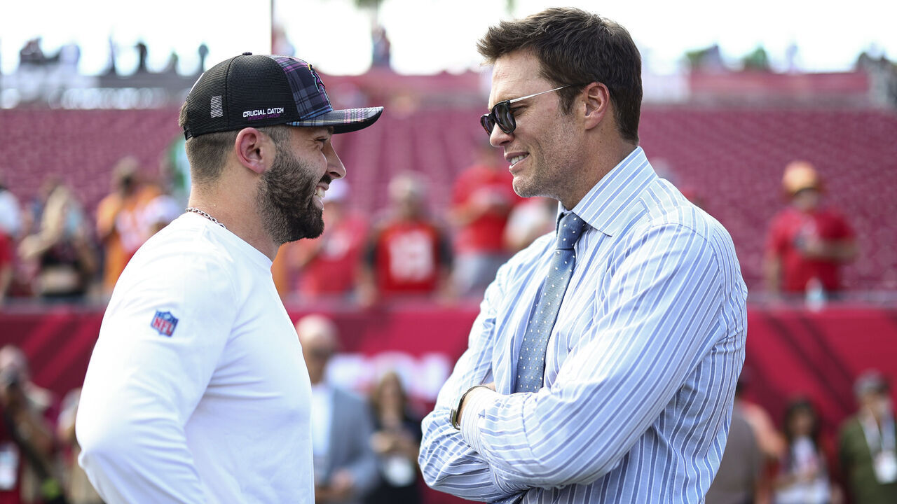 TAMPA, FL - SEPTEMBER 29: Fox Sports commentator and former NFL quarterback Tom Brady talks with Baker Mayfield #6 of the Tampa Bay Buccaneers prior to an NFL football game between the Tampa Bay Buccaneers and the Philadelphia Eagles at Raymond James Stadium on September 29, 2024 in Tampa, Florida.