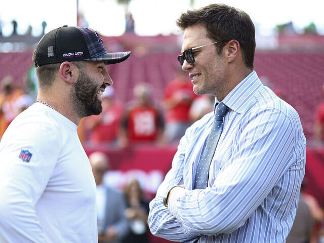 TAMPA, FL - SEPTEMBER 29: Fox Sports commentator and former NFL quarterback Tom Brady talks with Baker Mayfield #6 of the Tampa Bay Buccaneers prior to an NFL football game between the Tampa Bay Buccaneers and the Philadelphia Eagles at Raymond James Stadium on September 29, 2024 in Tampa, Florida.