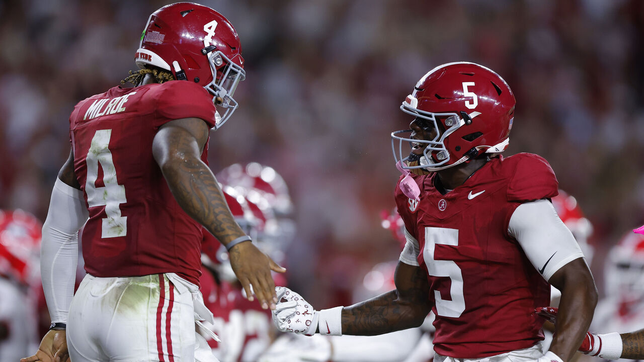 TUSCALOOSA, ALABAMA - SEPTEMBER 28: Jalen Milroe #4 of the Alabama Crimson Tide celebrates after his rushing touchdown against the Georgia Bulldogs with Germie Bernard #5 during the second quarter at Bryant-Denny Stadium on September 28, 2024 in Tuscaloosa, Alabama.