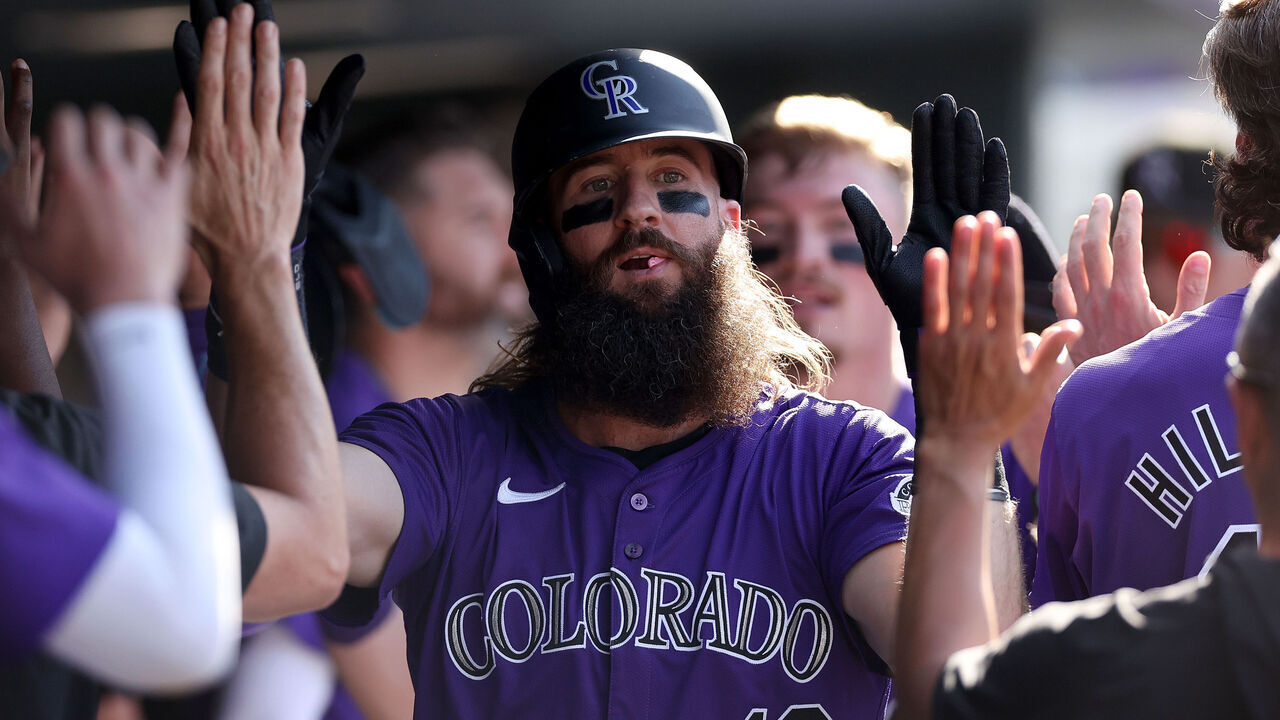 DENVER, COLORADO - SEPTEMBER 26: Charlie Blackmon #19 of the Colorado Rockies celebrates in the dugout after scoring on a Ezequiel Tovar double against the St. Louis Cardinals in the eighth inning at Coors Field on September 26, 2024 in Denver, Colorado.
