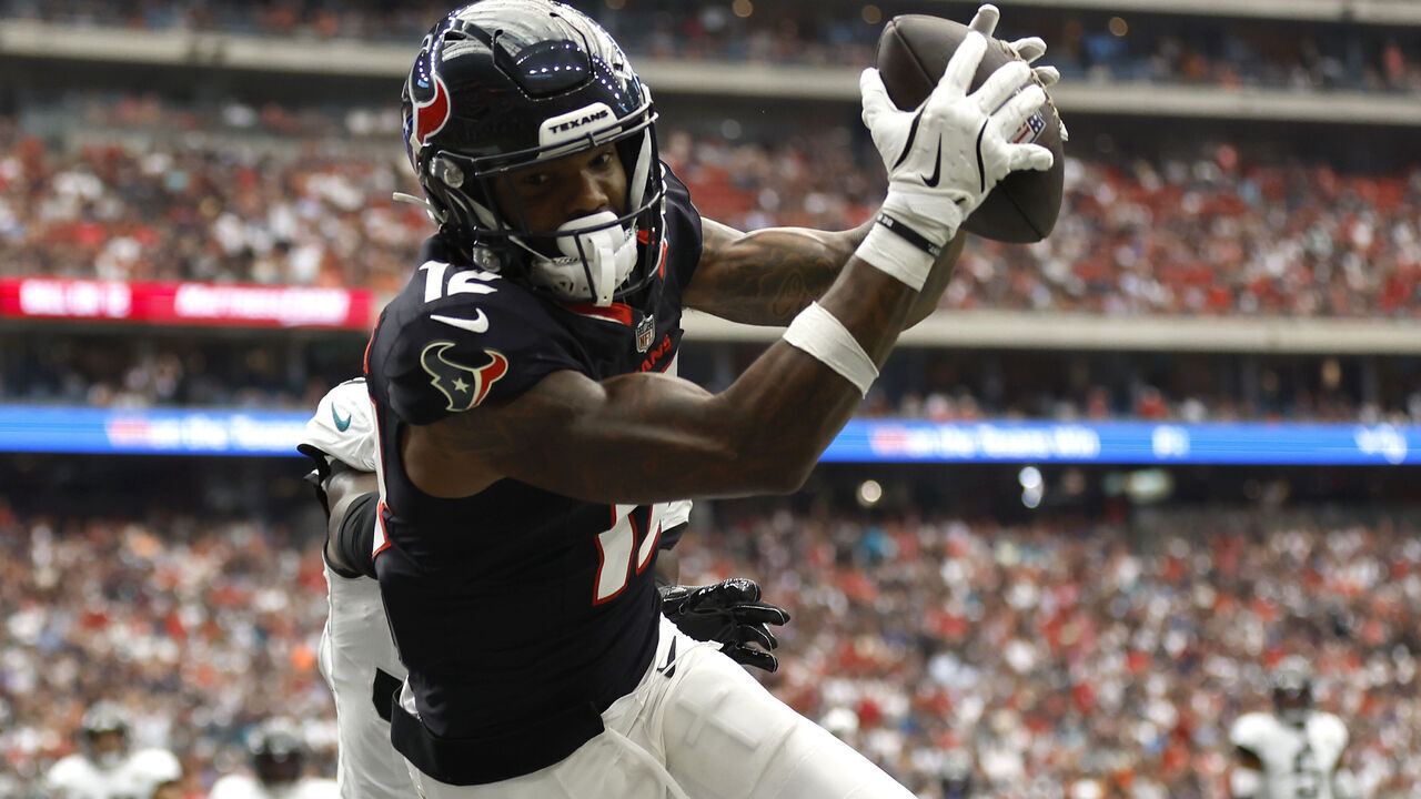 HOUSTON, TEXAS - SEPTEMBER 29: Nico Collins #12 of the Houston Texans attempts to catch a pass against the Jacksonville Jaguars during the first half at NRG Stadium on September 29, 2024 in Houston, Texas.