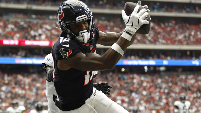 HOUSTON, TEXAS - SEPTEMBER 29: Nico Collins #12 of the Houston Texans attempts to catch a pass against the Jacksonville Jaguars during the first half at NRG Stadium on September 29, 2024 in Houston, Texas.