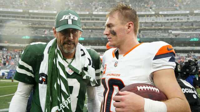 EAST RUTHERFORD, NEW JERSEY - SEPTEMBER 29: Aaron Rodgers (8) of the New York Jets and Bo Nix (10) of the Denver Broncos talk after the Broncos beat the Jets at MetLife Stadium on September 29, 2024 in East Rutherford, New Jersey.
