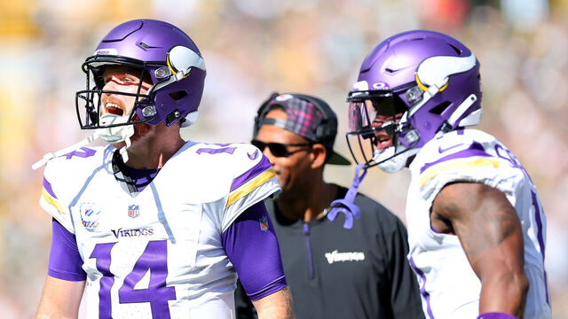 GREEN BAY, WISCONSIN - SEPTEMBER 29: Sam Darnold #14 of the Minnesota Vikings reacts after a touchdown during the second quarter of the game against the Green Bay Packers at Lambeau Field on September 29, 2024 in Green Bay, Wisconsin.