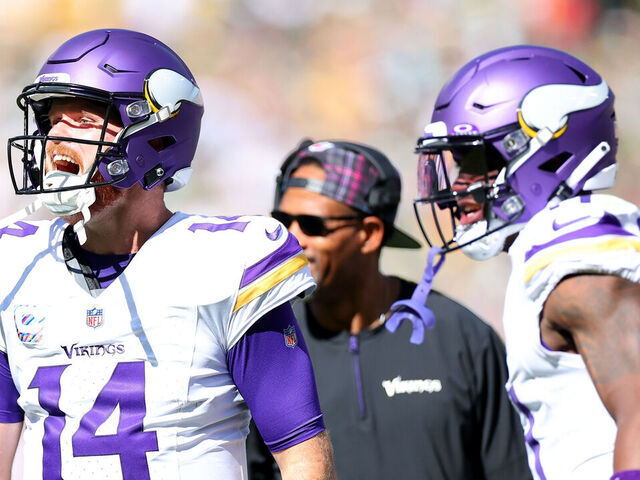 GREEN BAY, WISCONSIN - SEPTEMBER 29: Sam Darnold #14 of the Minnesota Vikings reacts after a touchdown during the second quarter of the game against the Green Bay Packers at Lambeau Field on September 29, 2024 in Green Bay, Wisconsin.