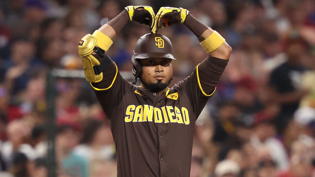 PHOENIX, ARIZONA - SEPTEMBER 27: Luis Arraez #4 of the San Diego Padres reacts after hitting a RBI triple during the fourth inning against the Arizona Diamondbacks at Chase Field on September 27, 2024 in Phoenix, Arizona.