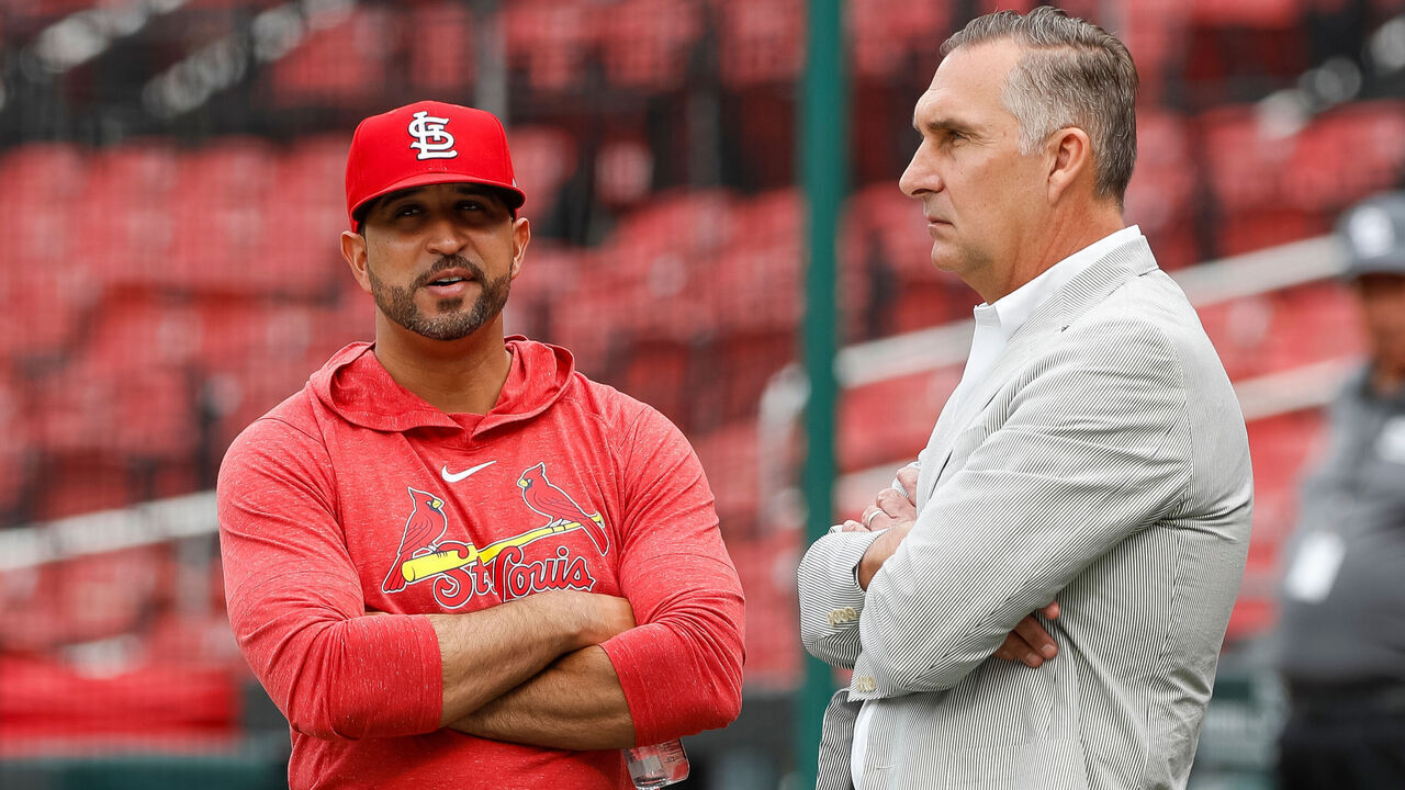 ST. LOUIS, MO - JULY 17: Manager Oliver Marmol (L) #37 talks with John Mozeliak, president of baseball operations of the St. Louis Cardinals prior to the start of a game against the Miami Marlins at Busch Stadium on July 17, 2023 in St. Louis, Missouri.