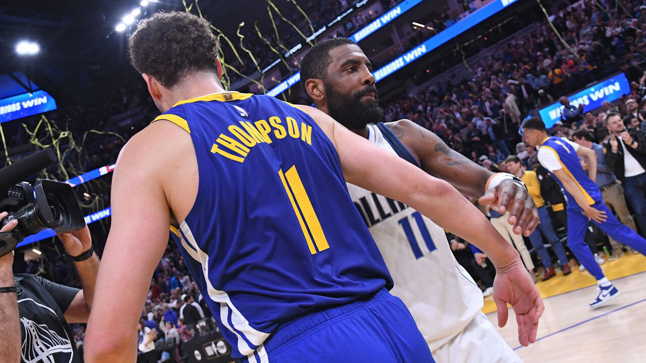 SAN FRANCISCO, CA - APRIL 2: Klay Thompson #11 of the Golden State Warriors and Kyrie Irving #11 of the Dallas Mavericks embrace after the game on April 2, 2024 at Chase Center in San Francisco, California. NOTE TO USER: User expressly acknowledges and agrees that, by downloading and or using this photograph, user is consenting to the terms and conditions of Getty Images License Agreement. Mandatory Copyright Notice: Copyright 2024 NBAE