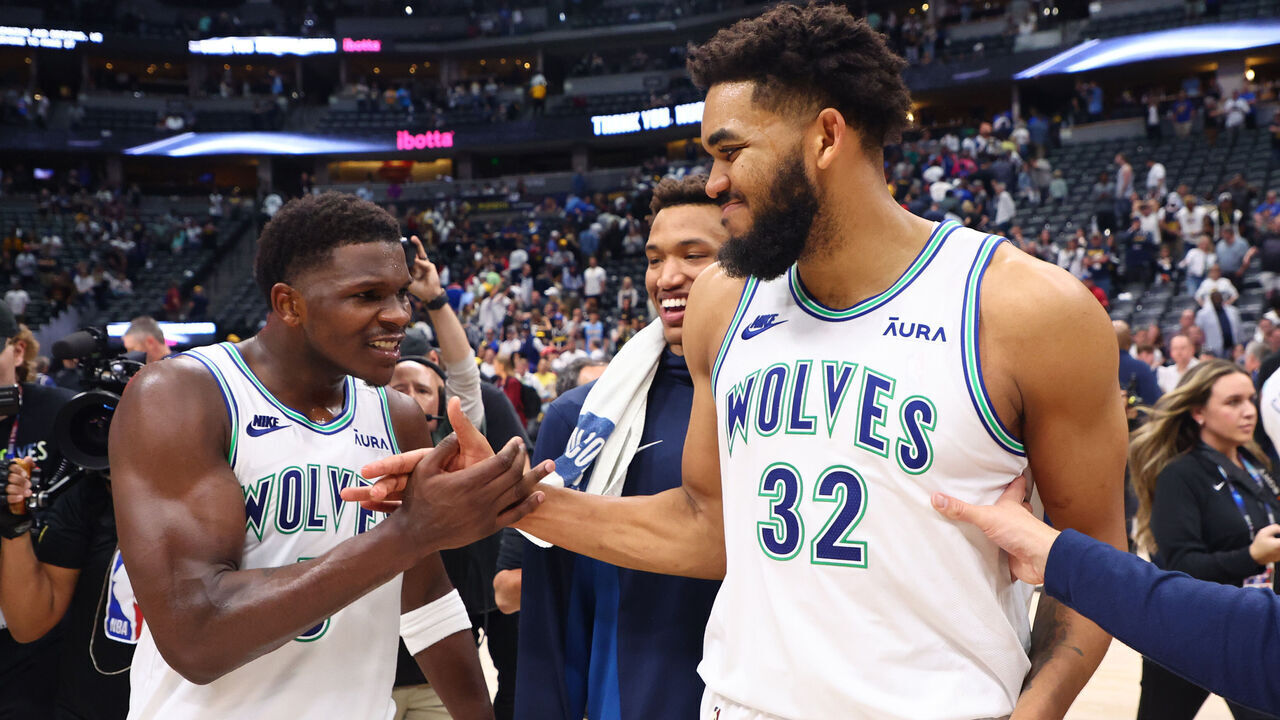DENVER, COLORADO - MAY 19: Anthony Edwards #5 and Karl-Anthony Towns #32 of the Minnesota Timberwolves celebrate after winning Game Seven of the Western Conference Second Round Playoffs against the Denver Nuggets at Ball Arena on May 19, 2024 in Denver, Colorado.