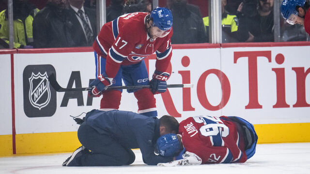 MONTREAL, QC - SEPTEMBER 28: Patrik Laine (92) of the Montreal Canadiens lays on the ice after being injured during the first period of the NHL pre-season game between the Toronto Maple Leafs and the Montreal Canadiens on Sept 28, 2024, at the Bell Centre in Montreal, QC