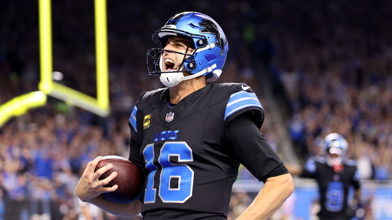 DETROIT, MICHIGAN - SEPTEMBER 30: Jared Goff #16 of the Detroit Lions celebrates after catching a touchdown pass thrown by Amon-Ra St. Brown #14 against the Seattle Seahawks during the third quarter at Ford Field on September 30, 2024 in Detroit, Michigan.