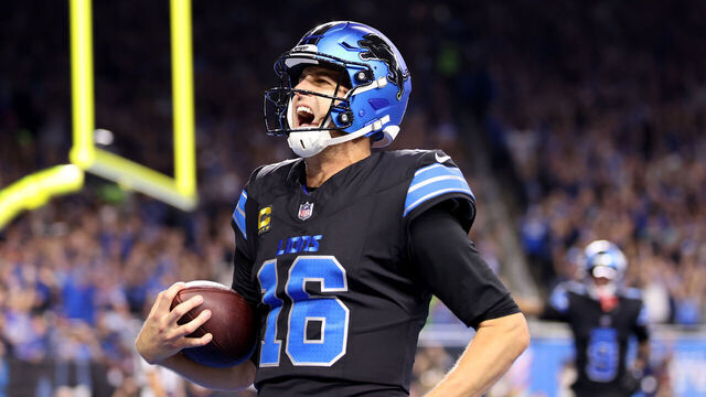 DETROIT, MICHIGAN - SEPTEMBER 30: Jared Goff #16 of the Detroit Lions celebrates after catching a touchdown pass thrown by Amon-Ra St. Brown #14 against the Seattle Seahawks during the third quarter at Ford Field on September 30, 2024 in Detroit, Michigan.