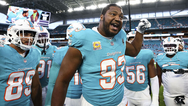 MIAMI GARDENS, FL - SEPTEMBER 30: Calais Campbell #93 of the Miami Dolphins gives a speech in the team huddle prior to a game against the Tennessee Titans at Hard Rock Stadium on September 30, 2024 in Miami Gardens, Florida.