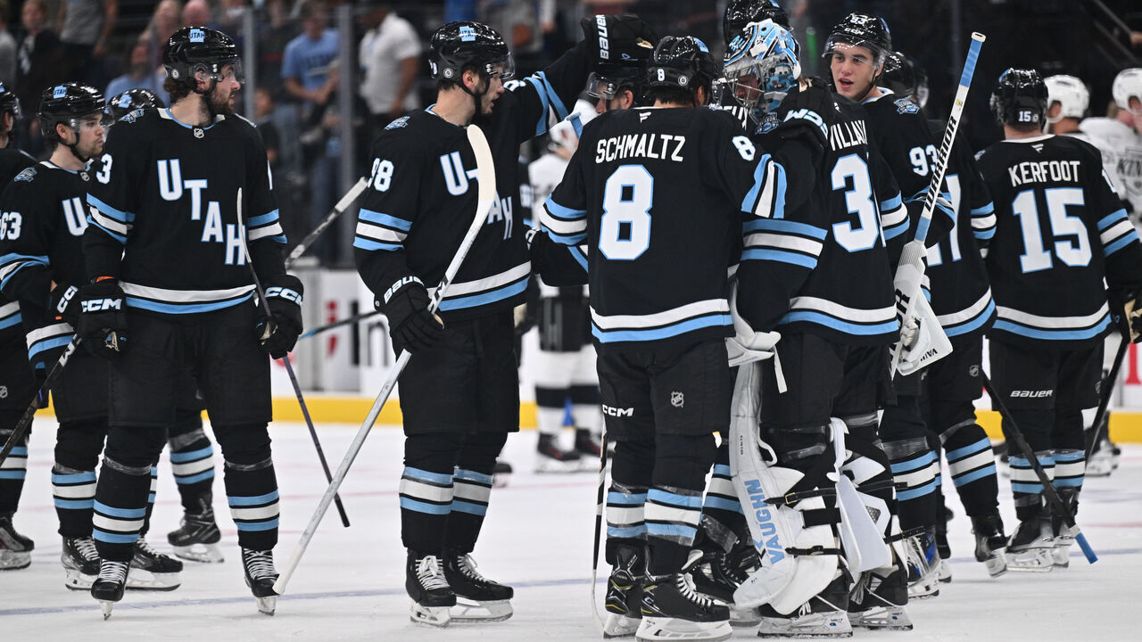 SALT LAKE CITY, UTAH - SEPTEMBER 23: Sean Durzi #50 of the Utah Hockey Club celebrates with goaltender Matt Villalta #31 after defeating the Los Angeles Kings 3-2 in overtime of a preseason game on September 23, 2024 at Delta Center in Salt Lake City, Utah.