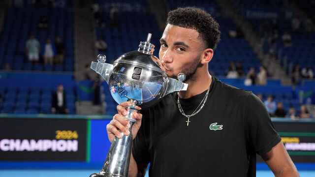 TOKYO, JAPAN - OCTOBER 01: Arthur Fils of France poses with the trophy after defeating Ugo Humbert of France in the championships - singles Final during day seven of Kinoshita Group Japan Open Tennis Championship at Ariake Coliseum on October 01, 2024 in Tokyo, Japan.