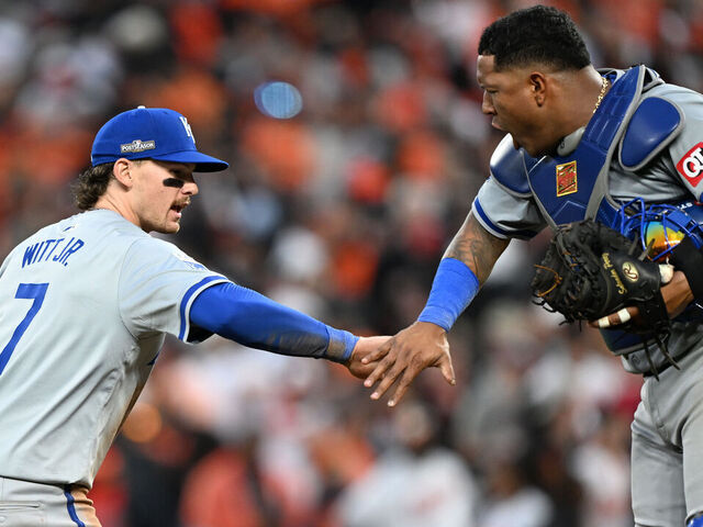 BALTIMORE, MARYLAND - OCTOBER 01: Bobby Witt Jr. #7 and Salvador Perez #13 of the Kansas City Royals celebrate after their team defeated the Baltimore Orioles in Game One of the Wild Card Series at Oriole Park at Camden Yards on October 01, 2024 in Baltimore, Maryland.