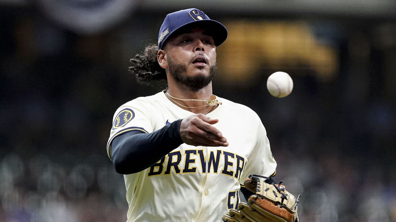 MILWAUKEE, WI - OCTOBER 01: Freddy Peralta #51 of the Milwaukee Brewers tosses to first base during Game 1 of the Wild Card Series presented by T-Mobile 5G Home Internet between the New York Mets and the Milwaukee Brewers at American Family Field on Tuesday, October 1, 2024 in Milwaukee, Wisconsin.