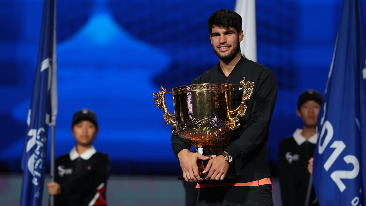 BEIJING, CHINA - OCTOBER 2: Carlos Alcaraz of Spain pose with the trophy after the Men's Singles Final match against Jannik Sinner of Italy on Day 10 of the China Open at National Tennis Center on October 02, 2024 in Beijing, China.