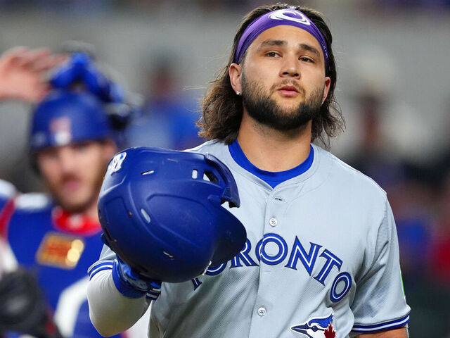 ARLINGTON, TEXAS - SEPTEMBER 17: Bo Bichette #11 of the Toronto Blue Jays reacts after striking out during the first inning against the Texas Rangers at Globe Life Field on September 17, 2024 in Arlington, Texas.